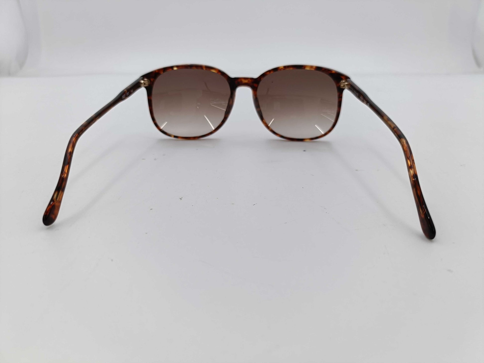 4 items including Armani, Louis Vuitton, Cartier, and Pucci sunglasses.