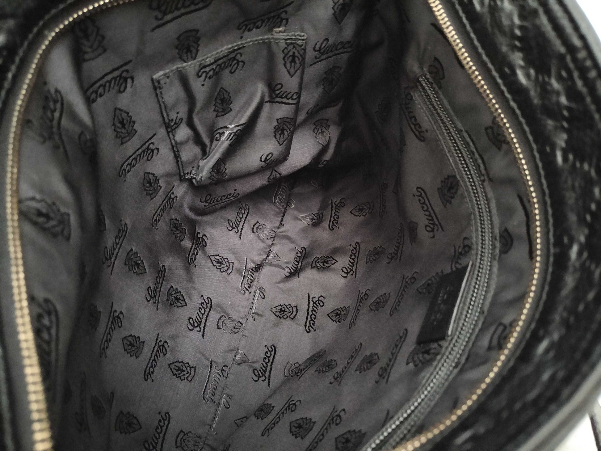 GUCCI Guccissima Leather Shoulder Bag with GG Pattern and Logo Plate 201446