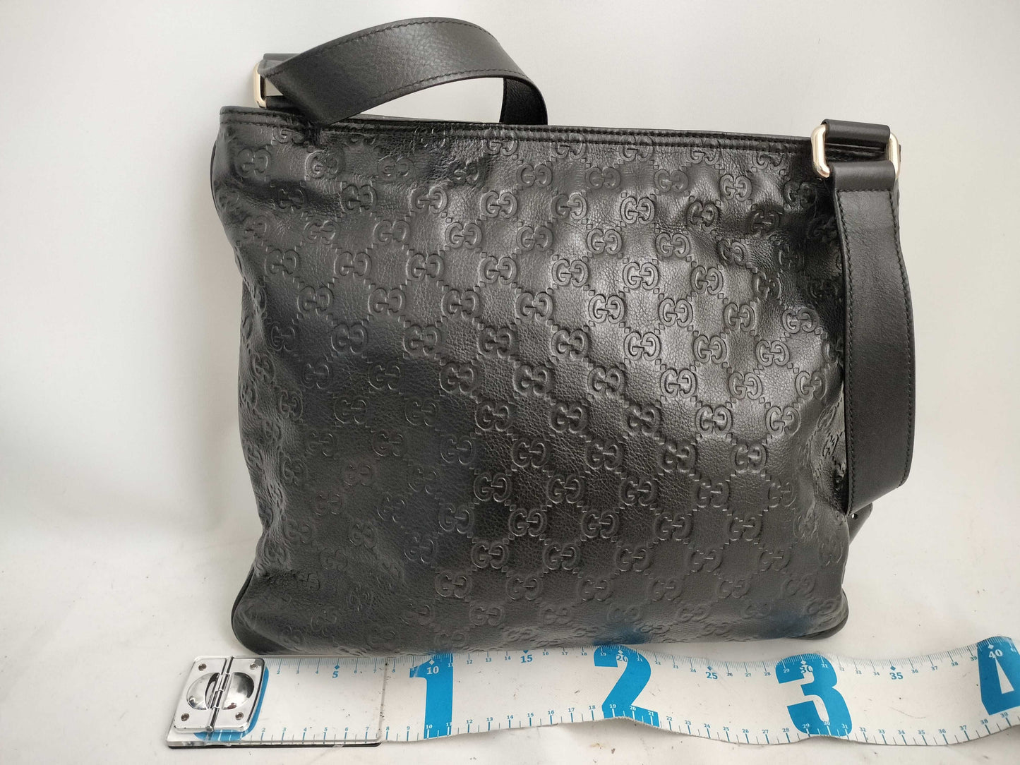 GUCCI Guccissima Leather Shoulder Bag with GG Pattern and Logo Plate 201446