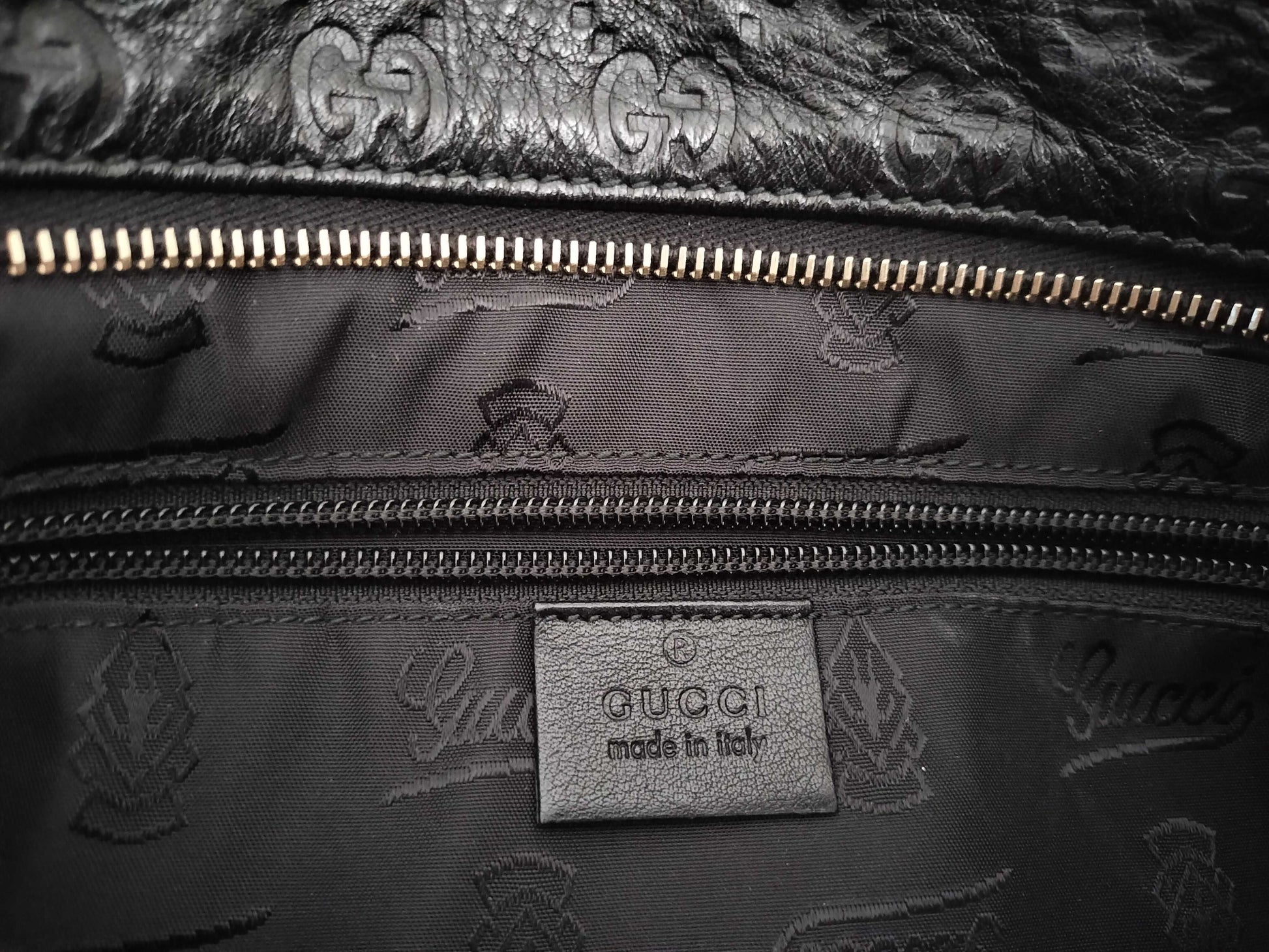 GUCCI Guccissima Leather Shoulder Bag with GG Pattern and Logo Plate 201446