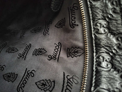 GUCCI Guccissima Leather Shoulder Bag with GG Pattern and Logo Plate 201446