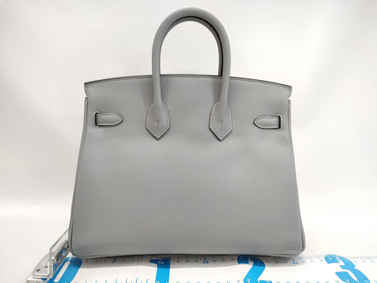 HERMES Birkin 25 in Platinum with Swift Champagne Gold Hardware and K Stamp.