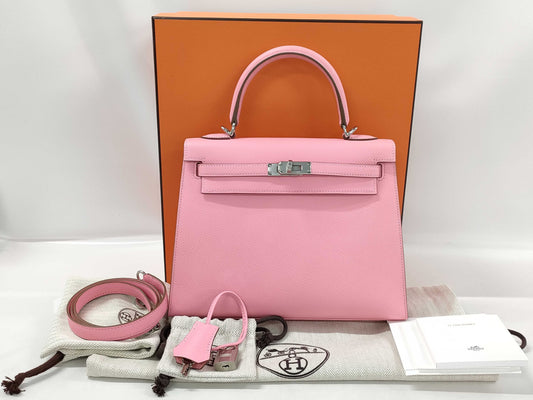 HERMES Kelly 25 handbag with rose confetti exterior, Epson logo, silver hardware, and a double stamp.