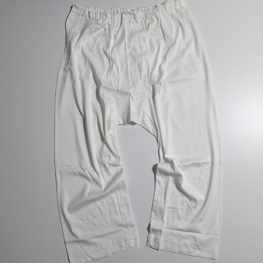 CELINE Brand new, unused cotton pants with a single Triomphe logo in white.