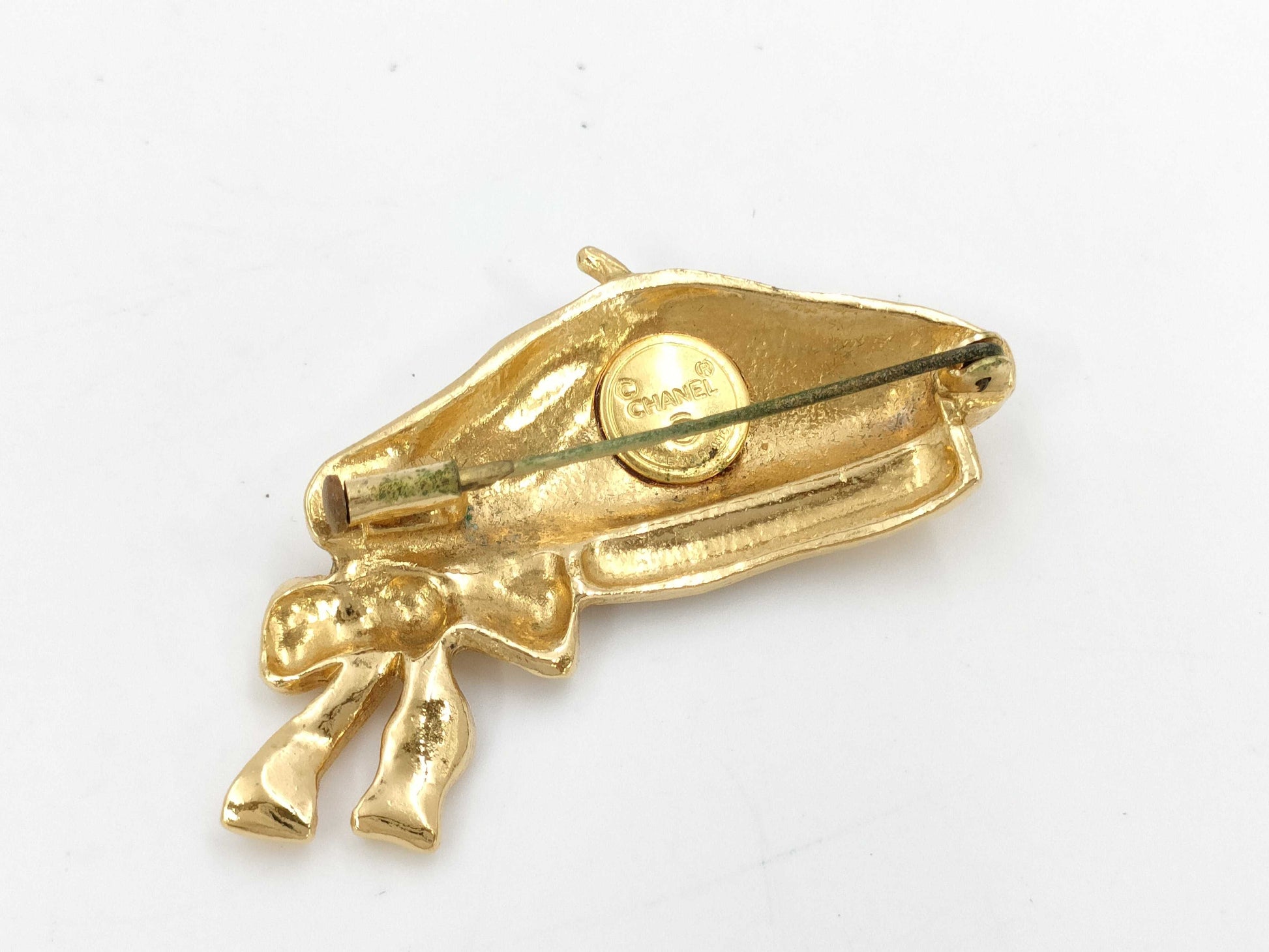 CHANEL beret brooch