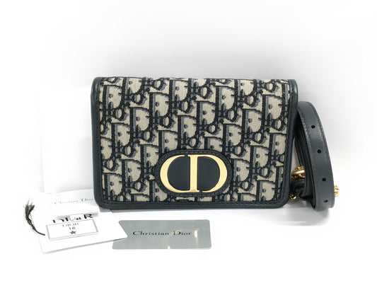 Dior Oblique 2-way waist pouch in navy, beige, and gold hardware. Canvas and leather shoulder bag.