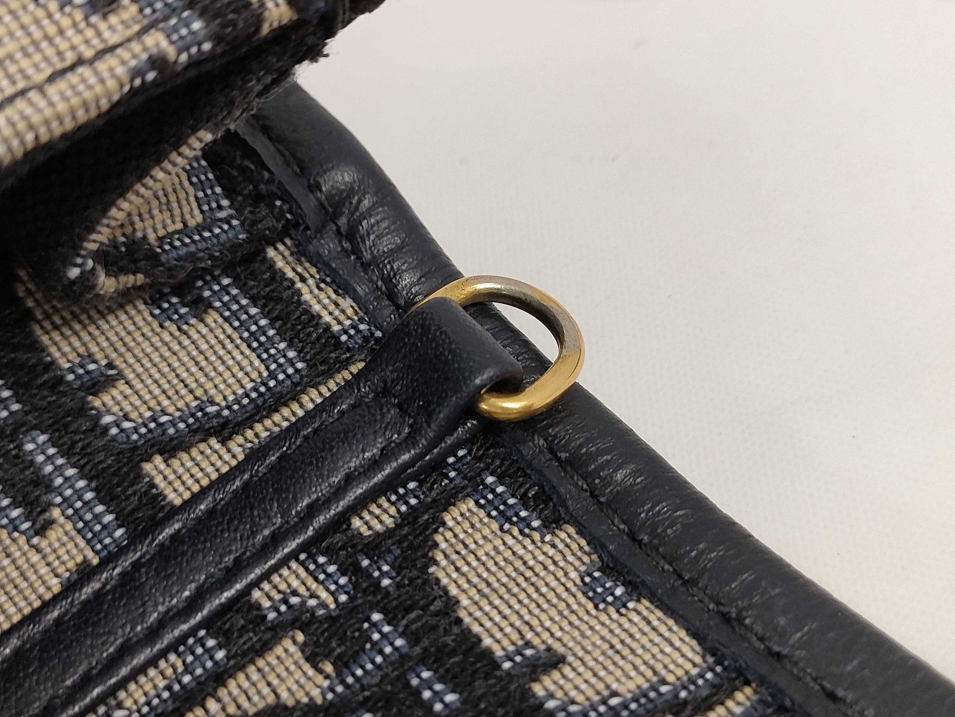 Dior Oblique 2-way waist pouch in navy, beige, and gold hardware. Canvas and leather shoulder bag.