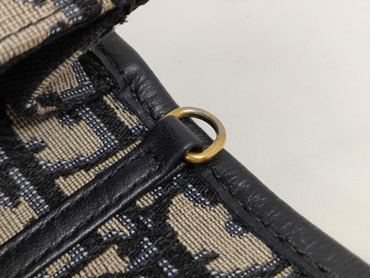 Dior Oblique 2-way waist pouch in navy, beige, and gold hardware. Canvas and leather shoulder bag.