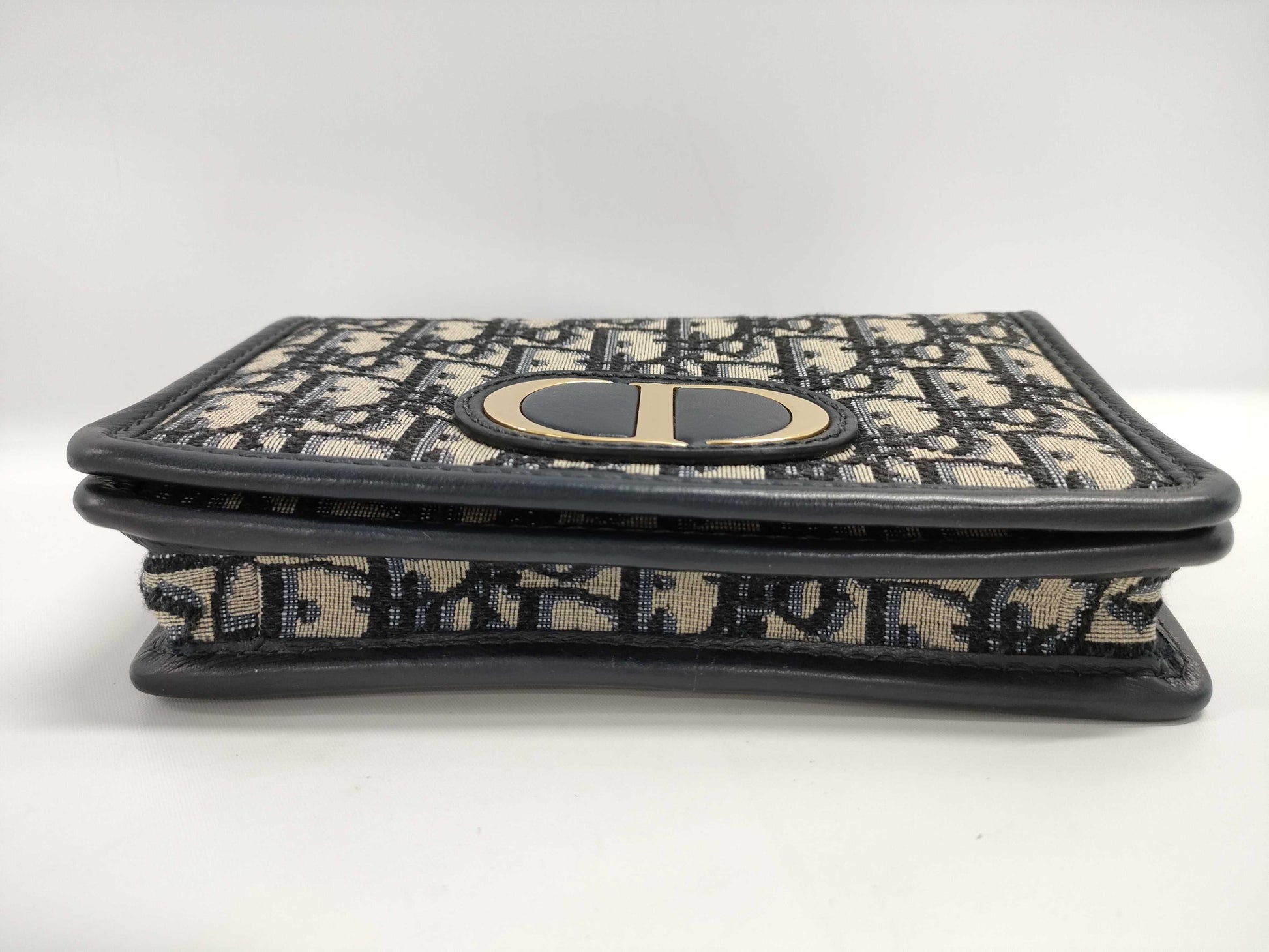Dior Oblique 2-way waist pouch in navy, beige, and gold hardware. Canvas and leather shoulder bag.