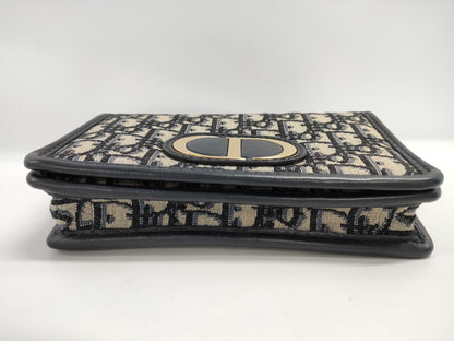 Dior Oblique 2-way waist pouch in navy, beige, and gold hardware. Canvas and leather shoulder bag.
