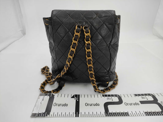 CHANEL Matelasse Lambskin Chain Backpack in Black with Gold Hardware