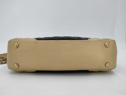 CHANEL V-stitch black and gold bag