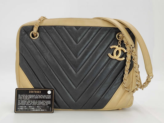 CHANEL V-stitch black and gold bag