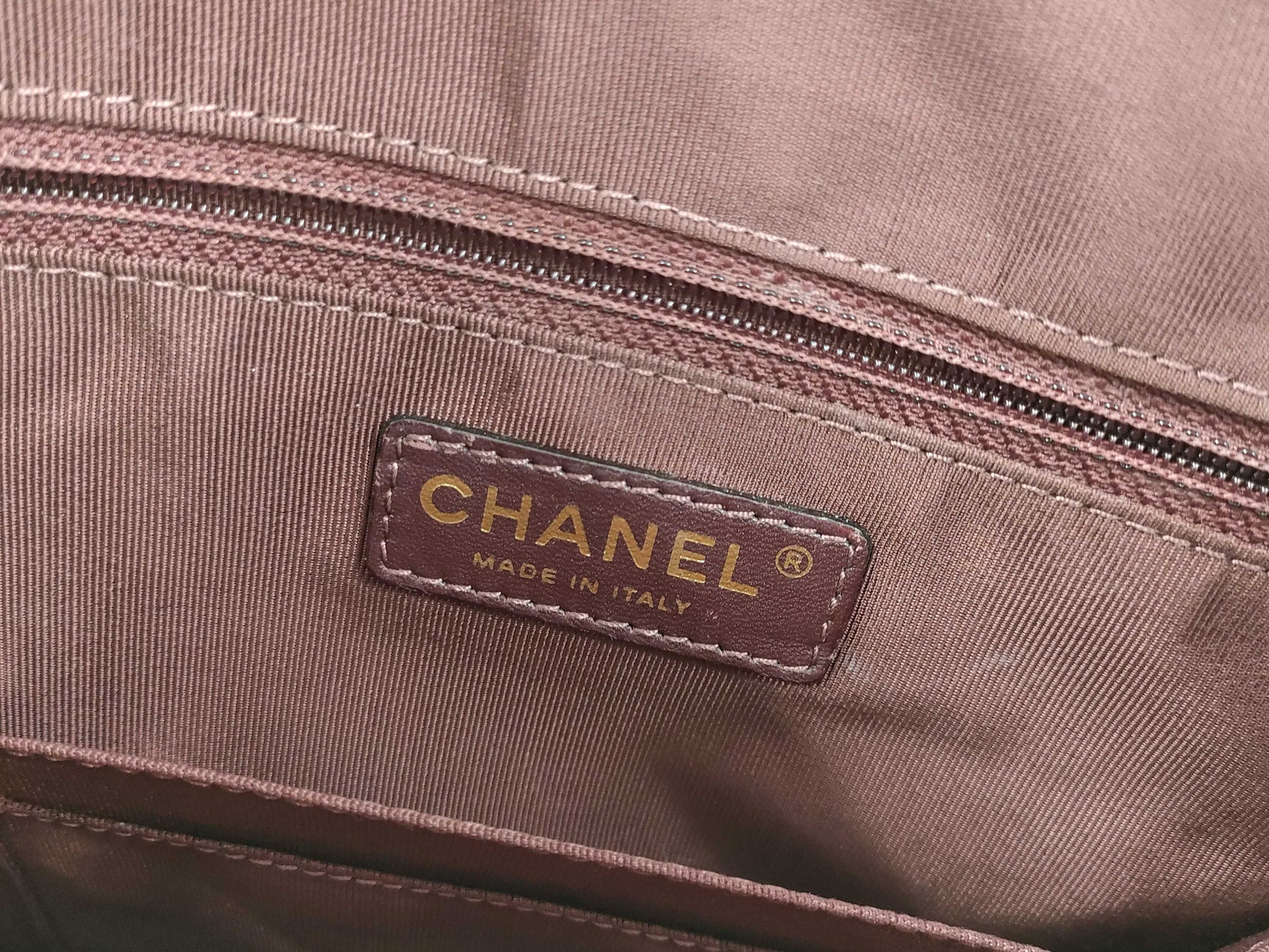 CHANEL V-stitch black and gold bag