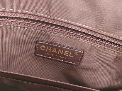 CHANEL V-stitch black and gold bag