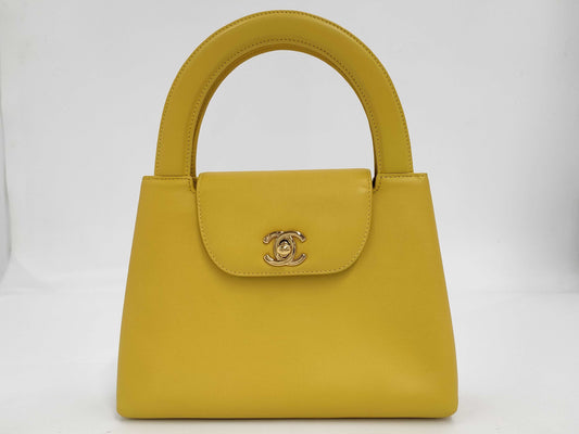 CHANEL Top Handle Lambskin Handbag with Turn Lock, Yellow