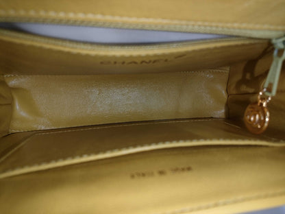 CHANEL Top Handle Lambskin Handbag with Turn Lock, Yellow