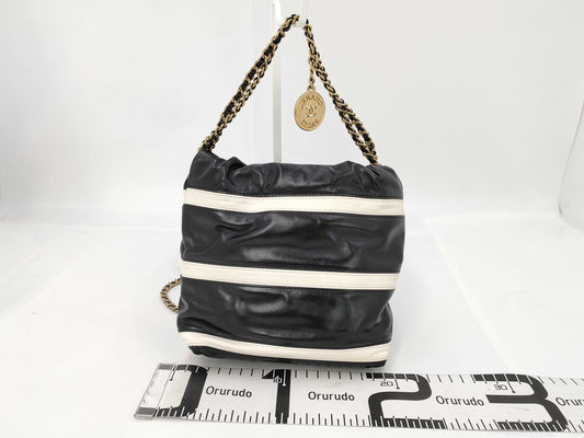 CHANEL CHANEL 22 Shiny Calfskin Chain Shoulder Bag AS3980 with Gold Hardware and Serial Number Plate in Black