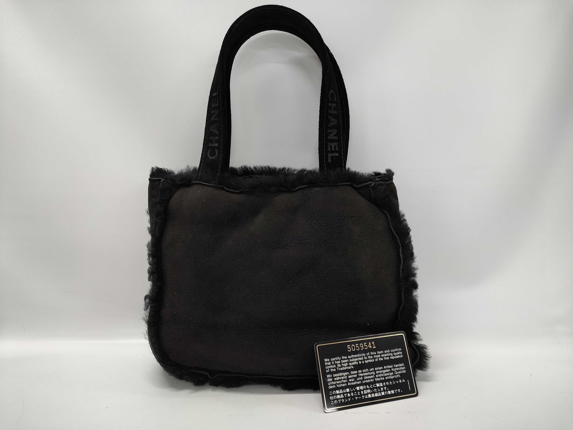 CHANEL Mouton Fur Handbag Black