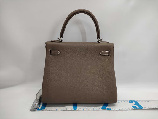 HERMES Kelly 25 Togo Etoupe Handbag with Silver Hardware, Inner Stitching, and K Stamp