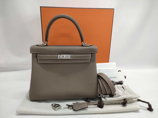 HERMES Kelly 25 Togo Etoupe Handbag with Silver Hardware, Inner Stitching, and K Stamp