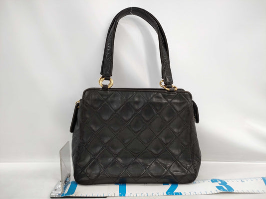 CHANEL Matelasse Lambskin Handbag in Black with Gold Hardware