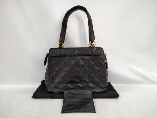 CHANEL Matelasse Lambskin Handbag in Black with Gold Hardware