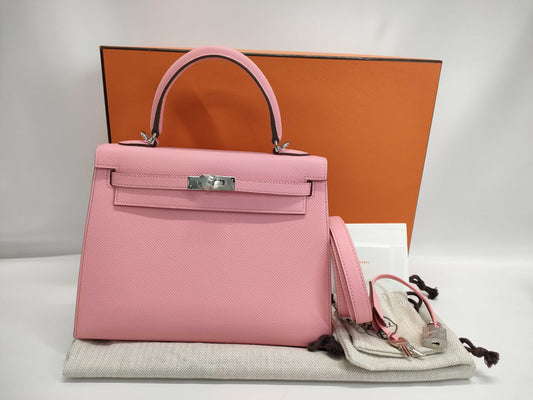 HERMES Kelly 25 handbag with rose confetti on the outside, Epson logo, silver hardware, K stamp.