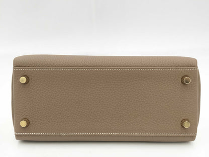 HERMES Kelly 25 Togo Etoupe Handbag with Gold Hardware and GP K Stamp