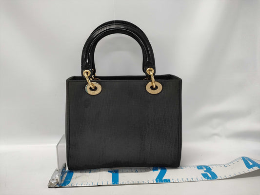 Dior Lady Dior Suede Black Handbag with dust bag and shoulder strap.
