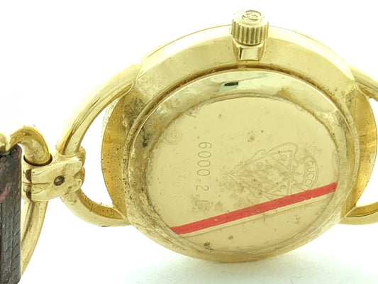 GUCCI Model Number 6000.2.1 Serial Number 0264658 GP/Leather/QZ Ivory Dial Non-Working/No Operational Guarantee Women's Watch