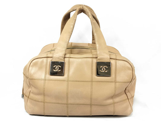 CHANEL Caviar Skin Handbag with Coco Mark and Silver Hardware, Beige