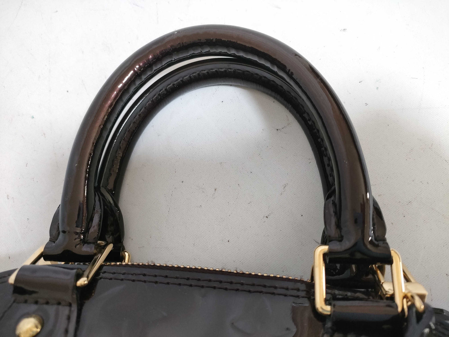 LOUIS VUITTON Vernis Amarante Alma Handbag