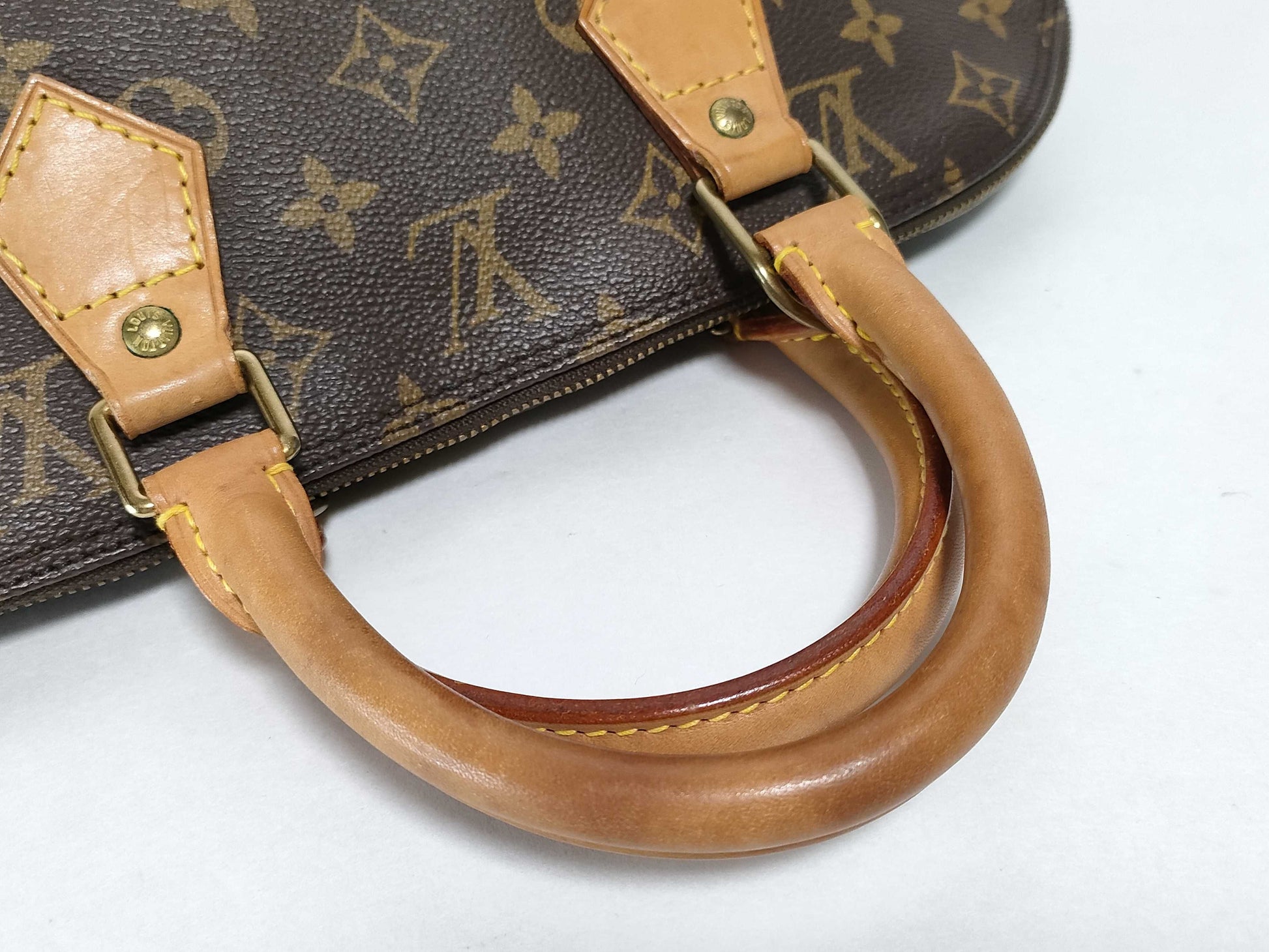 LOUIS VUITTON Monogram Alma Handbag