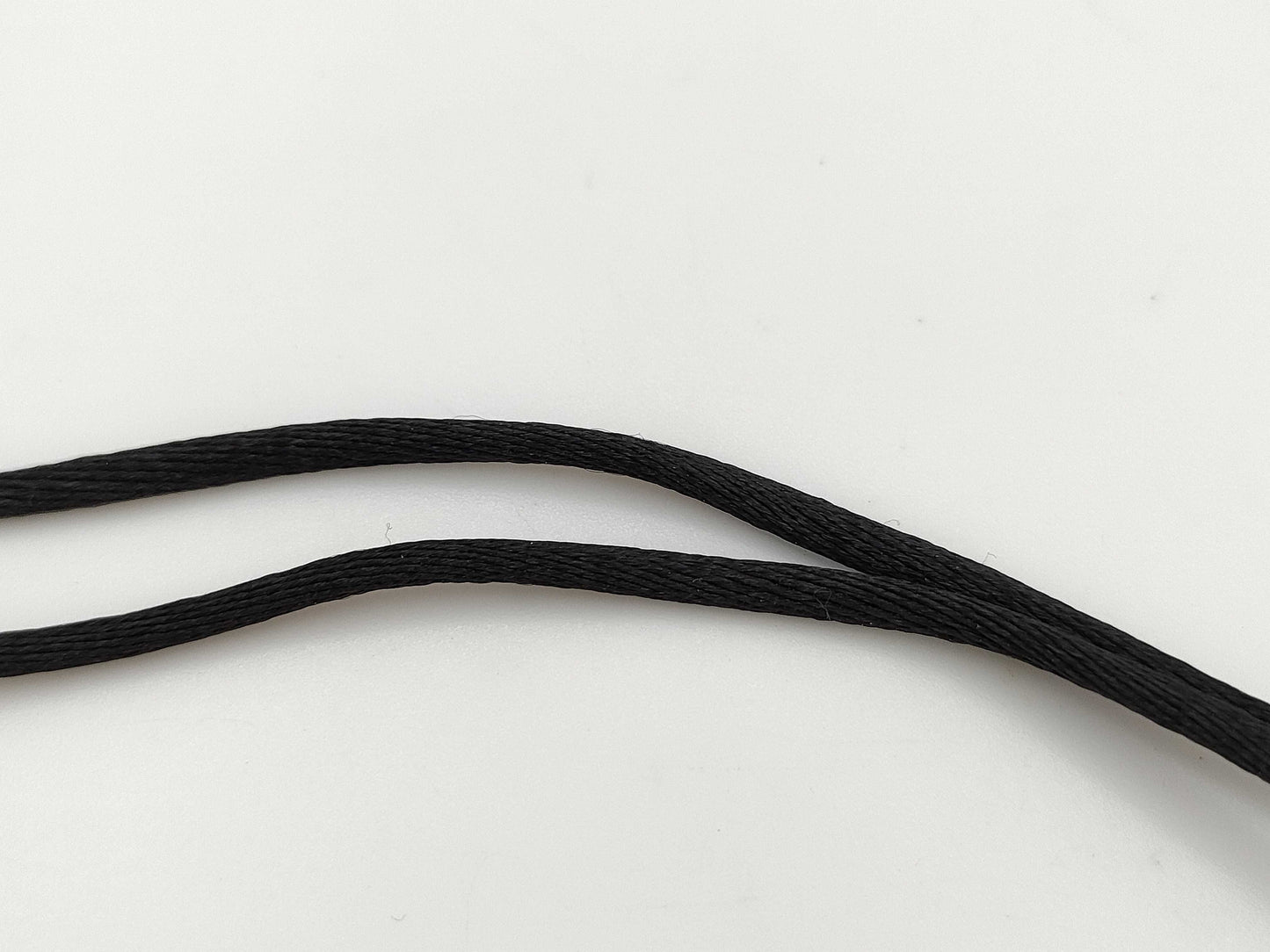 Dior logo mirror ball necklace with rhinestones and lip gloss.