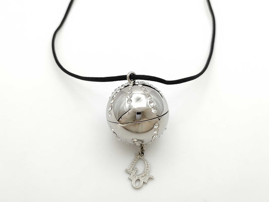 Dior logo mirror ball necklace with rhinestones and lip gloss.