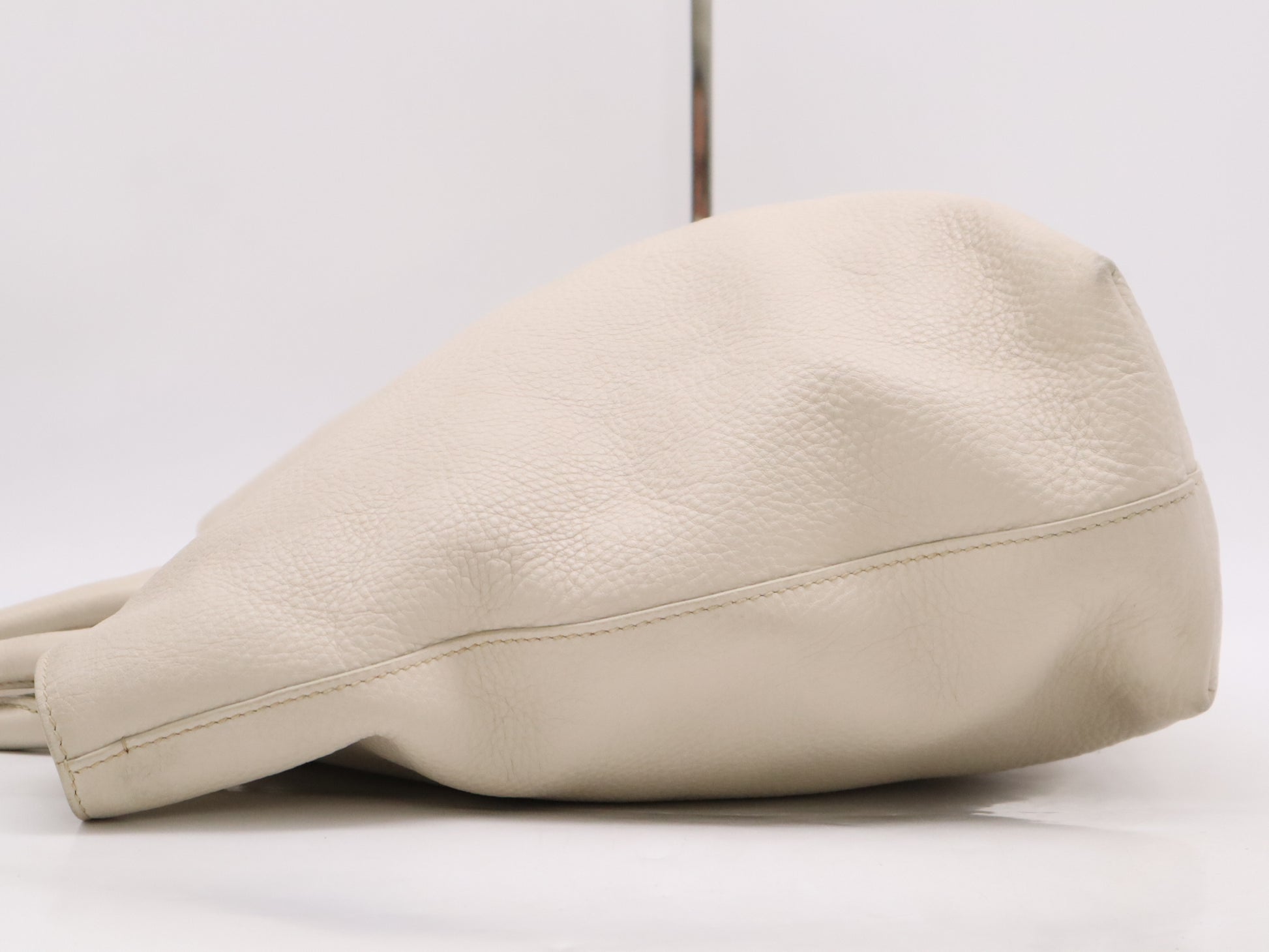 PRADA 2-way leather tote bag in white with GD hardware, shoulder strap, and name tag.