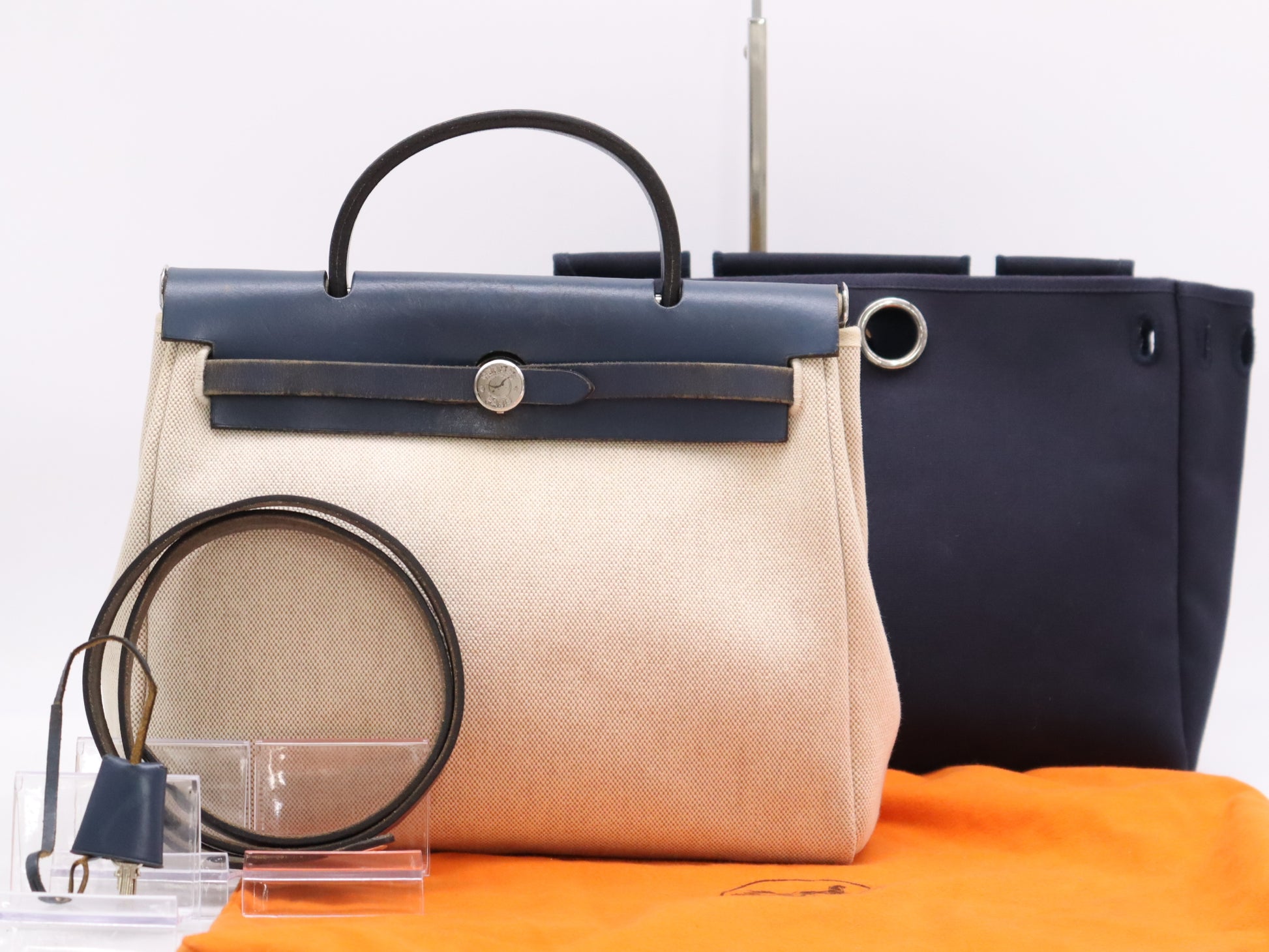 HERMES Leather Air Bag PM Shoulder Bag with Shoulder Strap, Padlock, 2 Keys, Cloche, and Dust Bag. Navy and White.