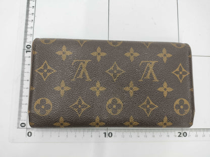 LOUIS VUITTON M Monogram Porte Tresor International Tri-fold Long Wallet