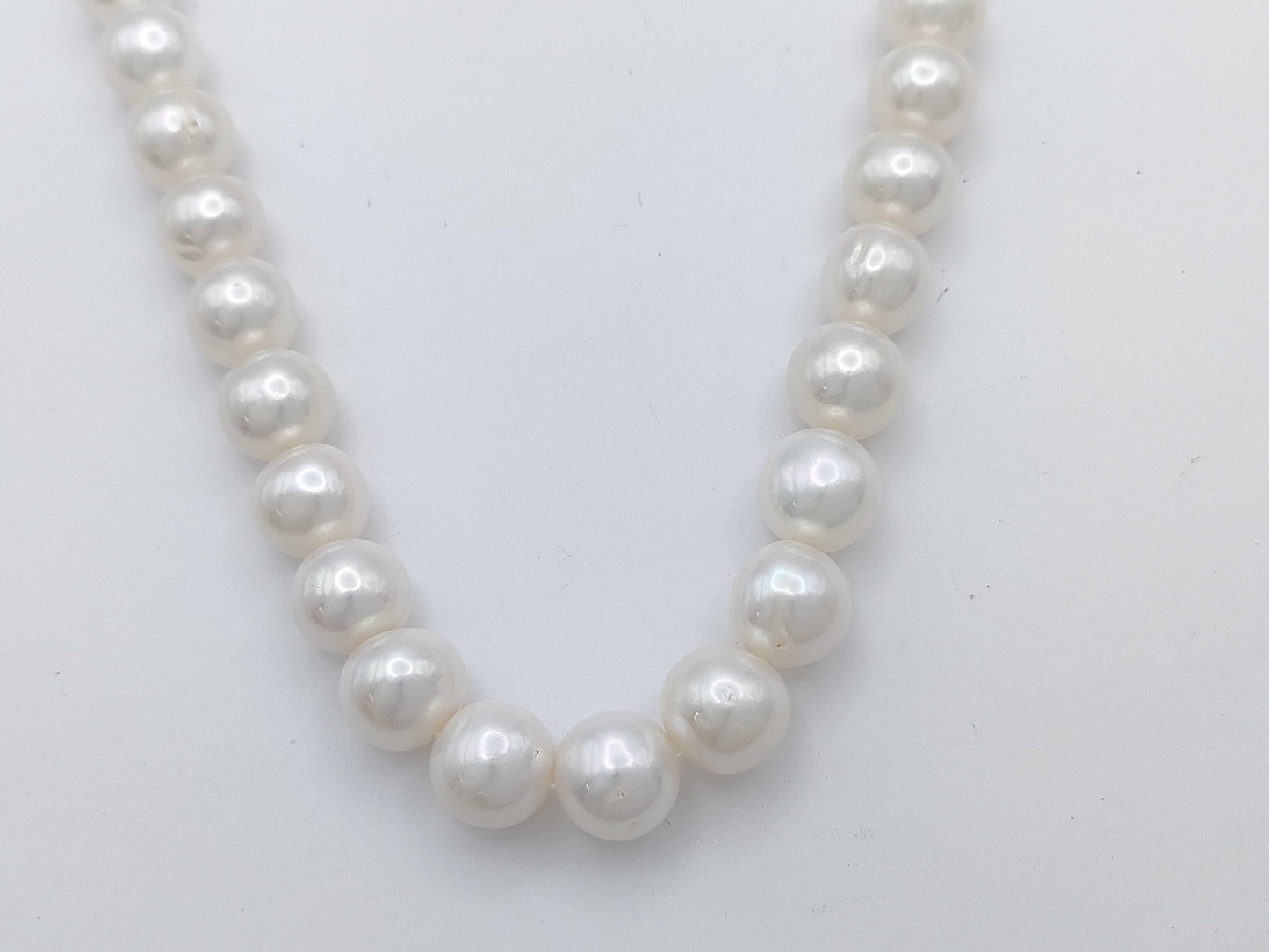 Semi-round pearl necklace, diameter approximately 9.4-10.5mm, sterling silver, 64.0g .