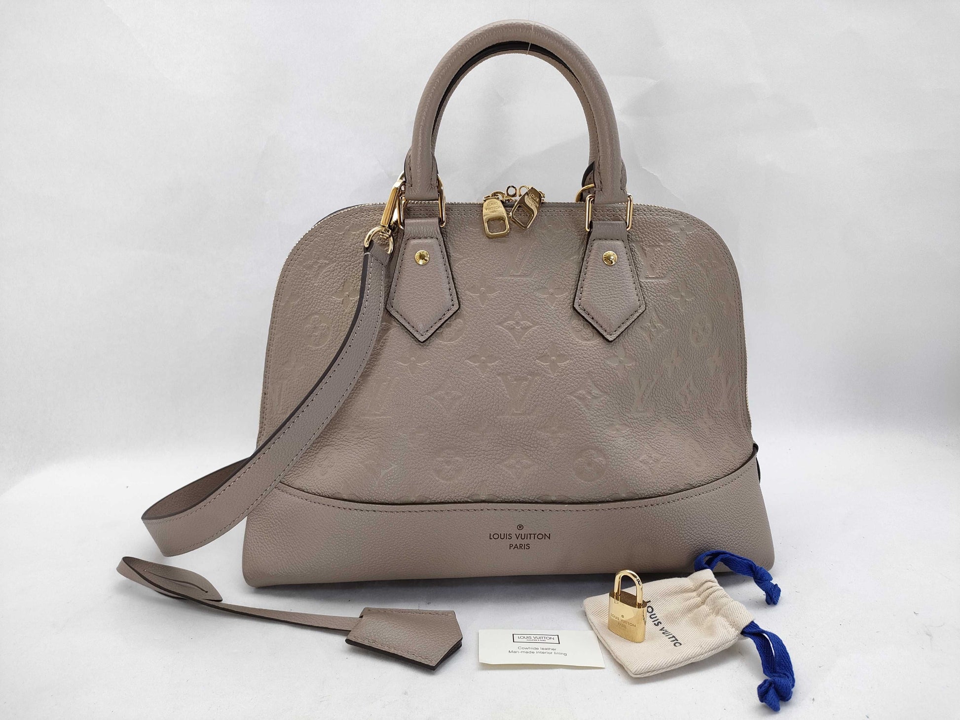 LOUIS VUITTON Monogram Empreinte Louis Vuitton Neo Alma Empreinte Handbag