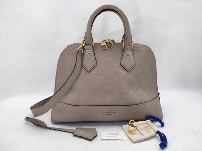 LOUIS VUITTON Monogram Empreinte Louis Vuitton Neo Alma Empreinte Handbag