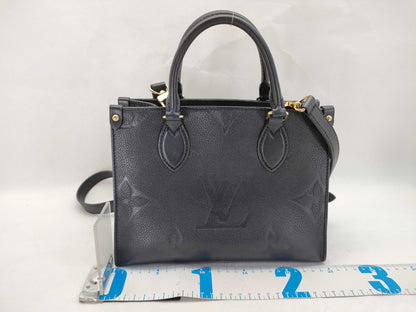 LOUIS VUITTON Monogram Empreinte Louis Vuitton On the Go PM Empreinte Handbag