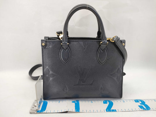 LOUIS VUITTON Monogram Empreinte Louis Vuitton On the Go PM Empreinte Handbag