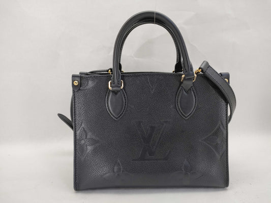 LOUIS VUITTON Monogram Empreinte Louis Vuitton On the Go PM Empreinte Handbag