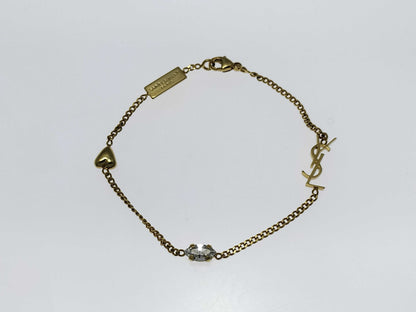Yves Saint Laurent YSL Logo Cassandra Heart Charm Bracelet in Gold with Rhinestones. Includes Box and Dust Bag.