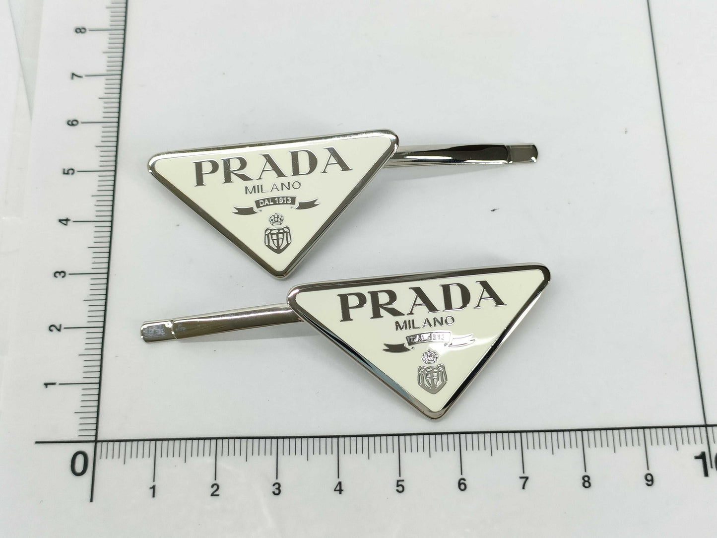 PRADA Prada Logo Hairpin. Accessories: Box, Dust Bag. Hair Accessory.