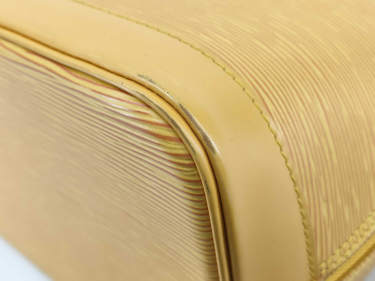 LOUIS VUITTON Epi Alma Yellow Handbag