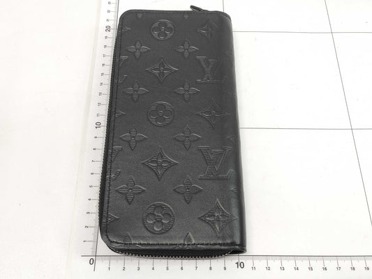 LOUIS VUITTON Zippy Wallet Vertical Monogram Shadow. Includes box, dust bag, and other original accessories. Brand new, unused wallet.