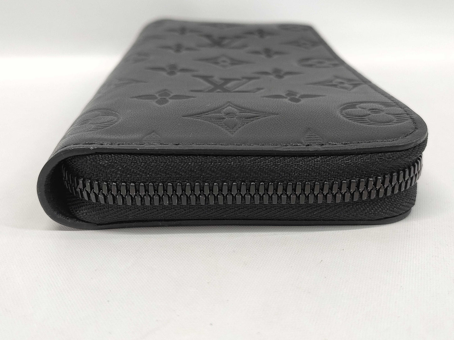 LOUIS VUITTON Zippy Wallet Vertical Monogram Shadow. Includes box, dust bag, and other original accessories. Brand new, unused wallet.